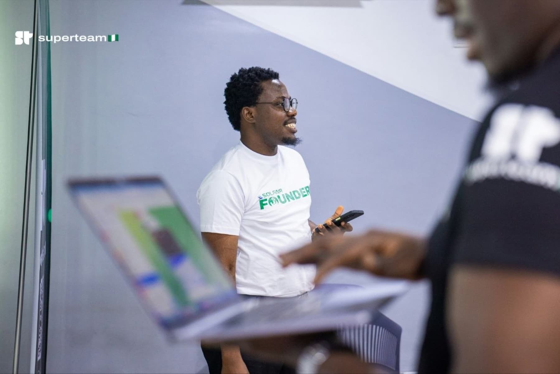 Victor collaborating with builders at a Superteam Nigeria event
